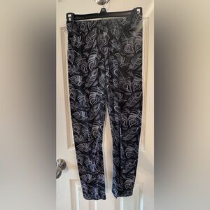 Black leggings with white peacock feathers, size S